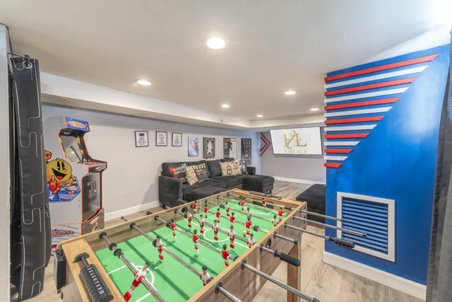 a bathroom with a sink mirror and toilet