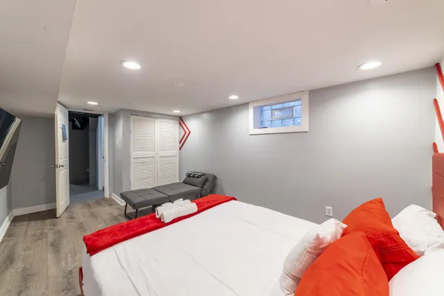 a bedroom with two beds and a table