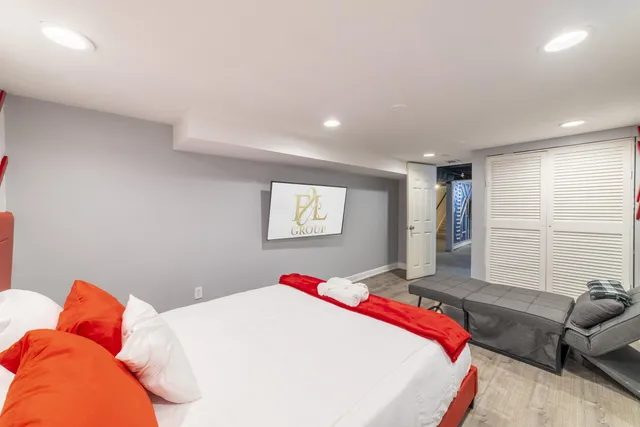 a bedroom with a bed and a table in it