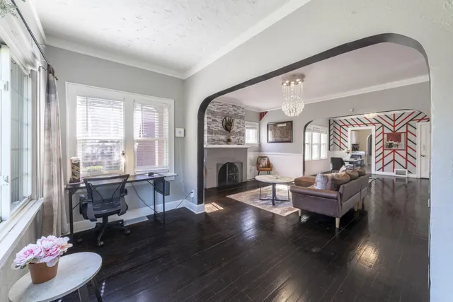 a living room with furniture and a fireplace