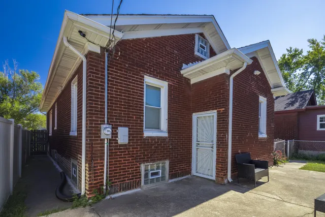 an aerial view of a house with a garden