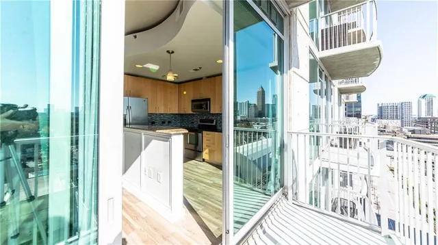 a view of a kitchen with a sink and dishwasher