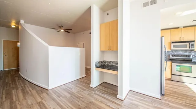 a view of a kitchen from the hallway
