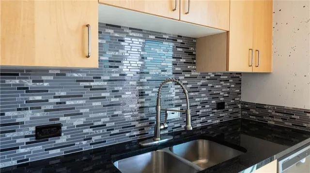 a kitchen with a sink and cabinets