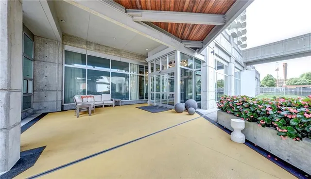 a swimming pool with outdoor seating and yard