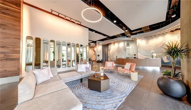 a living room with furniture and a large window