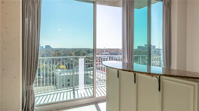 a view of a balcony with wooden floor