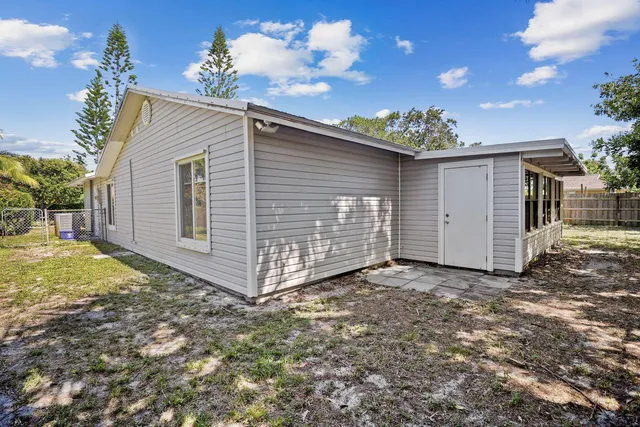 a view of a house with a yard and garage