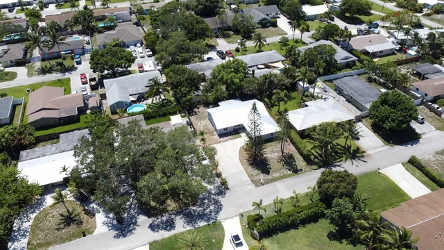 an aerial view of residential houses with outdoor space
