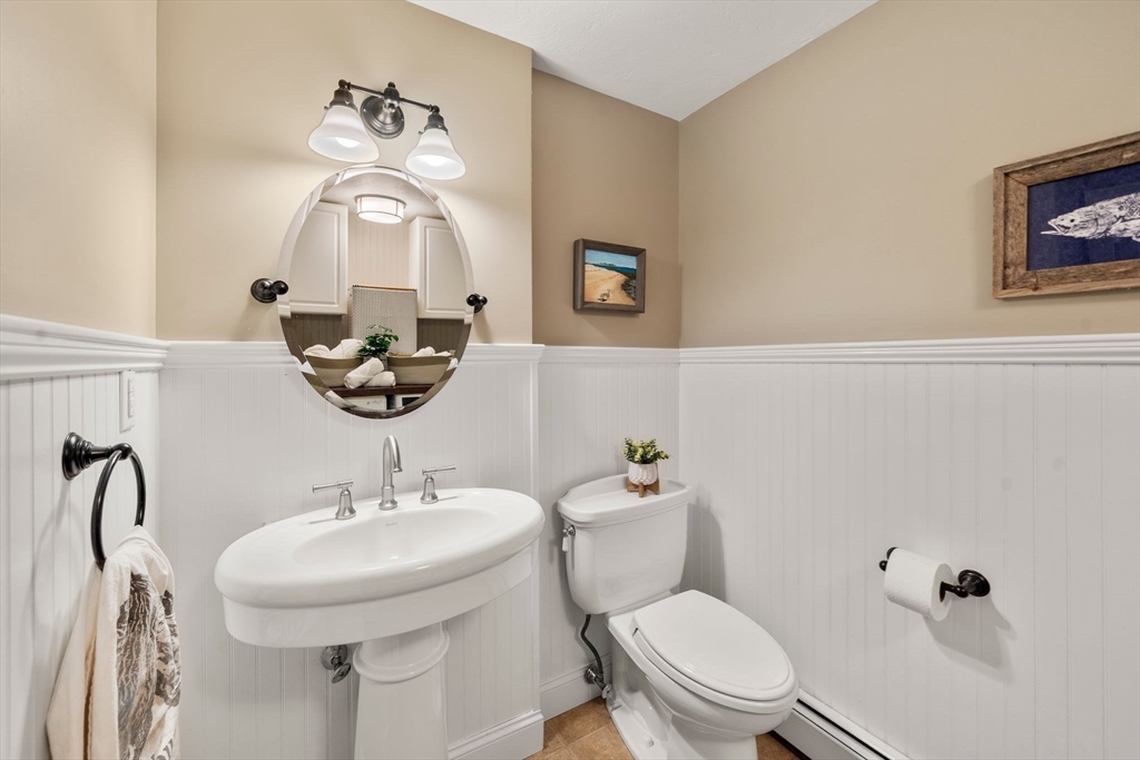 20 Island Creek Road Duxbury, MA 02332 - Photo 15 of 42 a bathroom with a toilet a sink and mirror