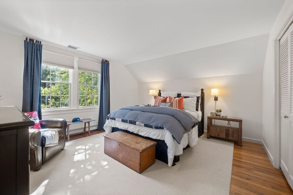 20 Island Creek Road Duxbury, MA 02332 - Photo 17 of 42 a spacious bedroom with a bed and a large window