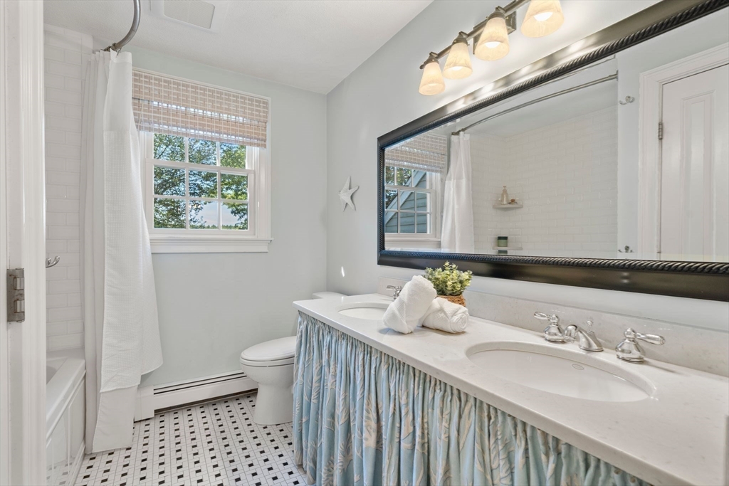 20 Island Creek Road Duxbury, MA 02332 - Photo 18 of 42 a bathroom with a sink a toilet and a mirror