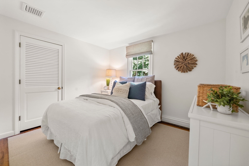 20 Island Creek Road Duxbury, MA 02332 - Photo 20 of 42 a bedroom with bed and window