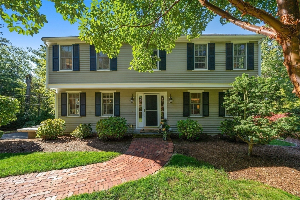 20 Island Creek Road Duxbury, MA 02332 - Photo 2 of 42 a front view of a house with garden and porch