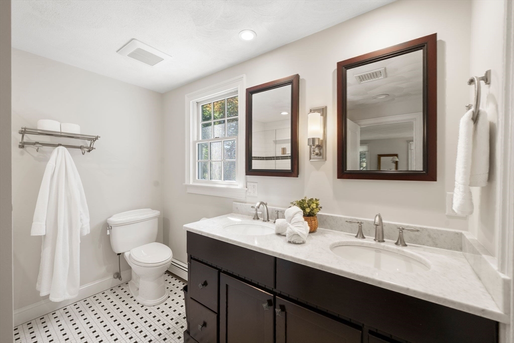 20 Island Creek Road Duxbury, MA 02332 - Photo 23 of 42 a bathroom with a sink a toilet and a mirror
