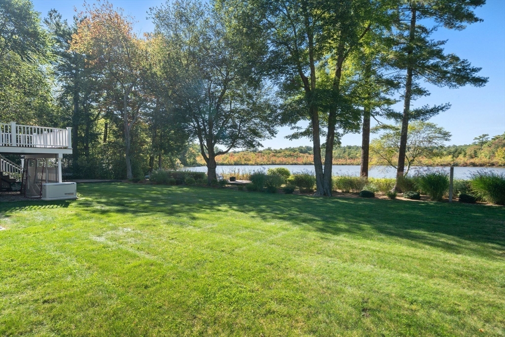20 Island Creek Road Duxbury, MA 02332 - Photo 32 of 42 a view of a backyard with a garden and trees