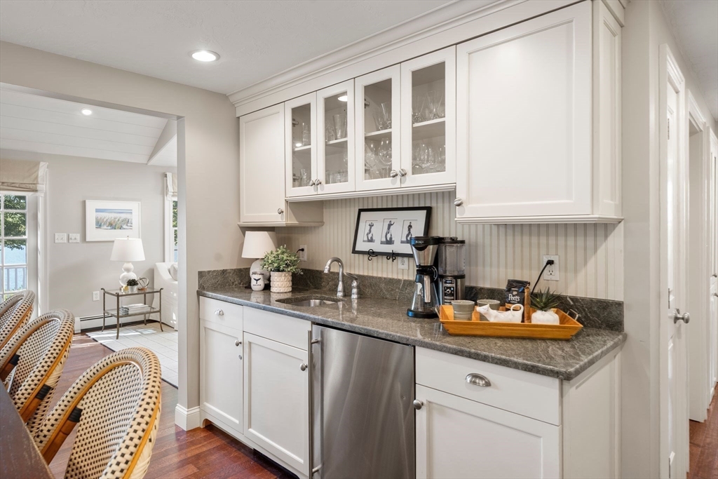 20 Island Creek Road Duxbury, MA 02332 - Photo 9 of 42 a kitchen with a sink stove and cabinets