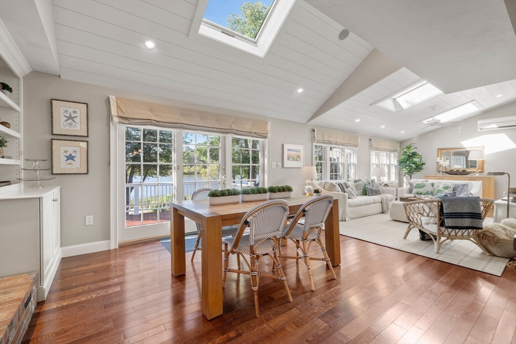 20 Island Creek Road Duxbury, MA 02332 - Photo 10 of 42 a view of a dining room with furniture window and wooden floor