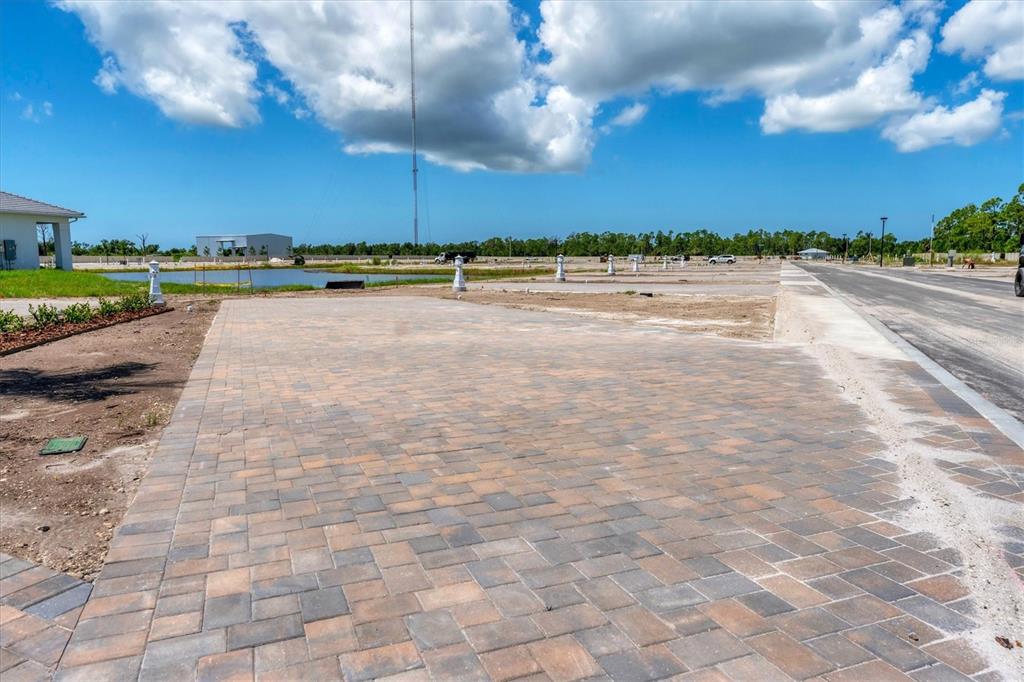 9001 Gasparilla Road, Unit 71 Placida, FL 33947 - Photo 23 of 60 a view of a swimming pool and an outdoor space