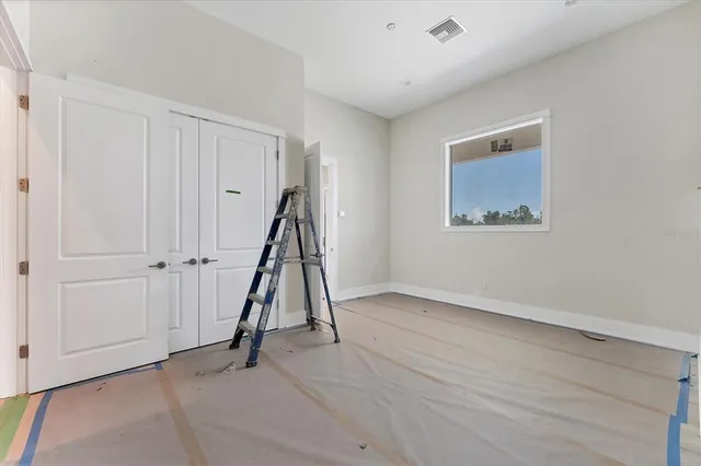 a large kitchen with a table and chairs in it