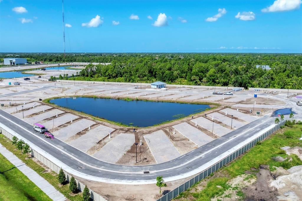 9001 Gasparilla Road, Unit 71 Placida, FL 33947 - Photo 4 of 60 a view of a swimming pool with a yard