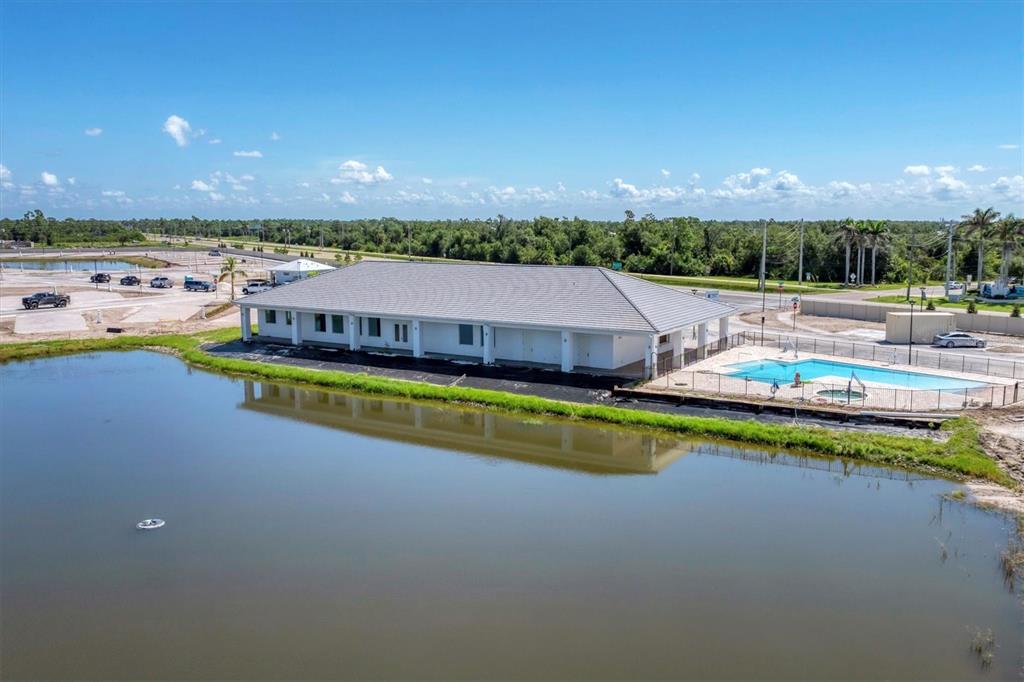 9001 Gasparilla Road, Unit 71 Placida, FL 33947 - Photo 55 of 60 a view of a swimming pool with an outdoor space and seating area