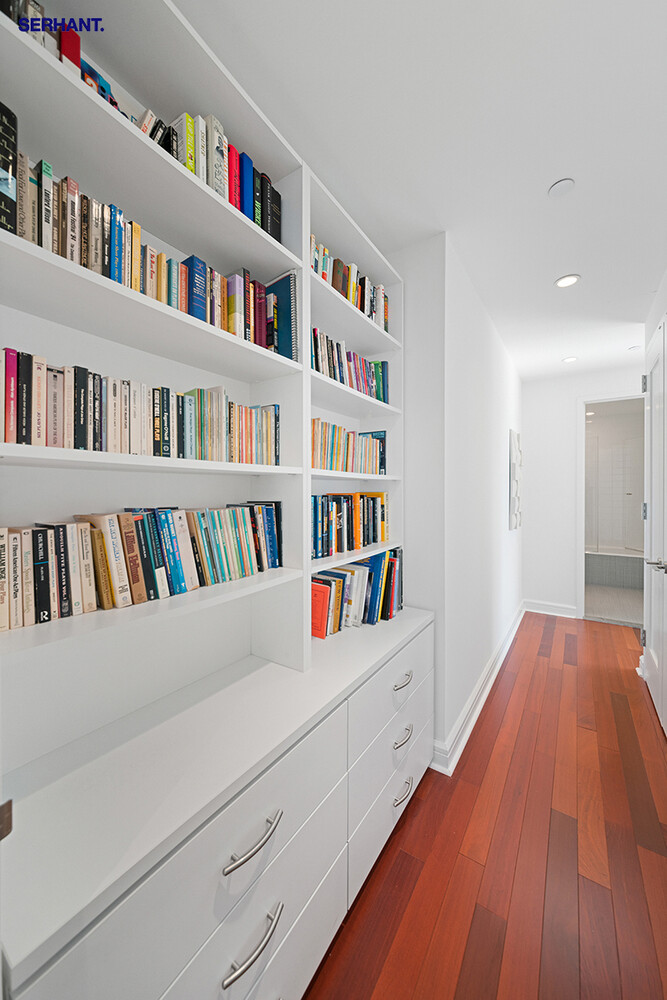 100 Riverside Boulevard, Unit 25D Manhattan, NY 10069 - Photo 11 of 21 a hallway with a book shelf and a book shelf