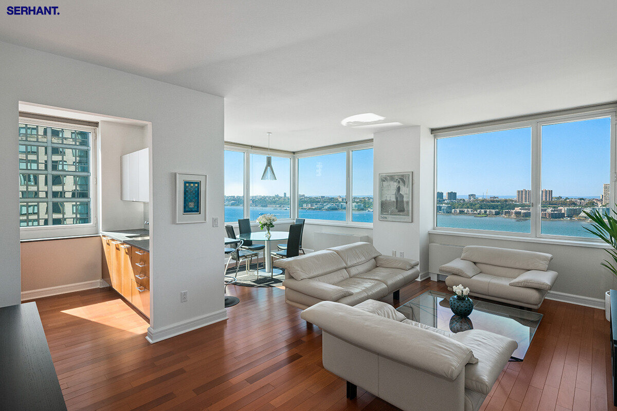 100 Riverside Boulevard, Unit 25D Manhattan, NY 10069 - Photo 2 of 21 a living room with furniture and a table