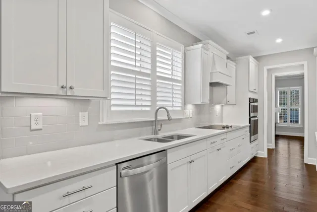 a kitchen with a sink and cabinets