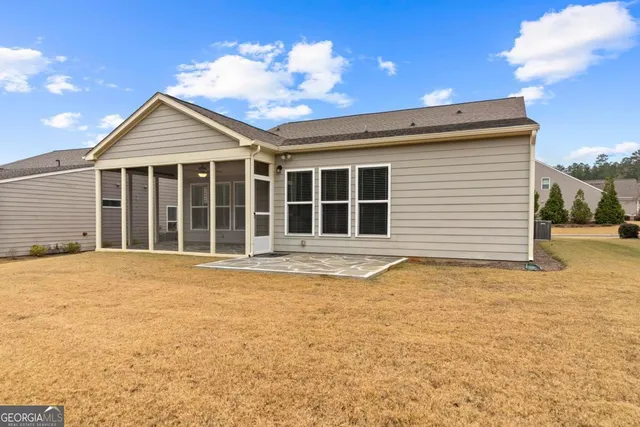 a blue bed sitting in a room