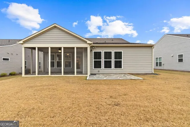 a view of a large house with a swimming pool