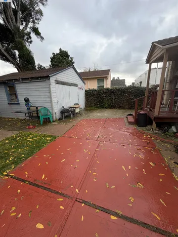a view of a backyard with sitting area