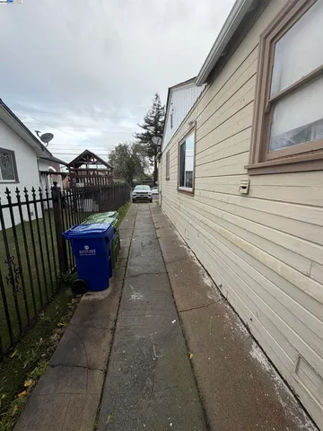 a back view of a house with a backyard