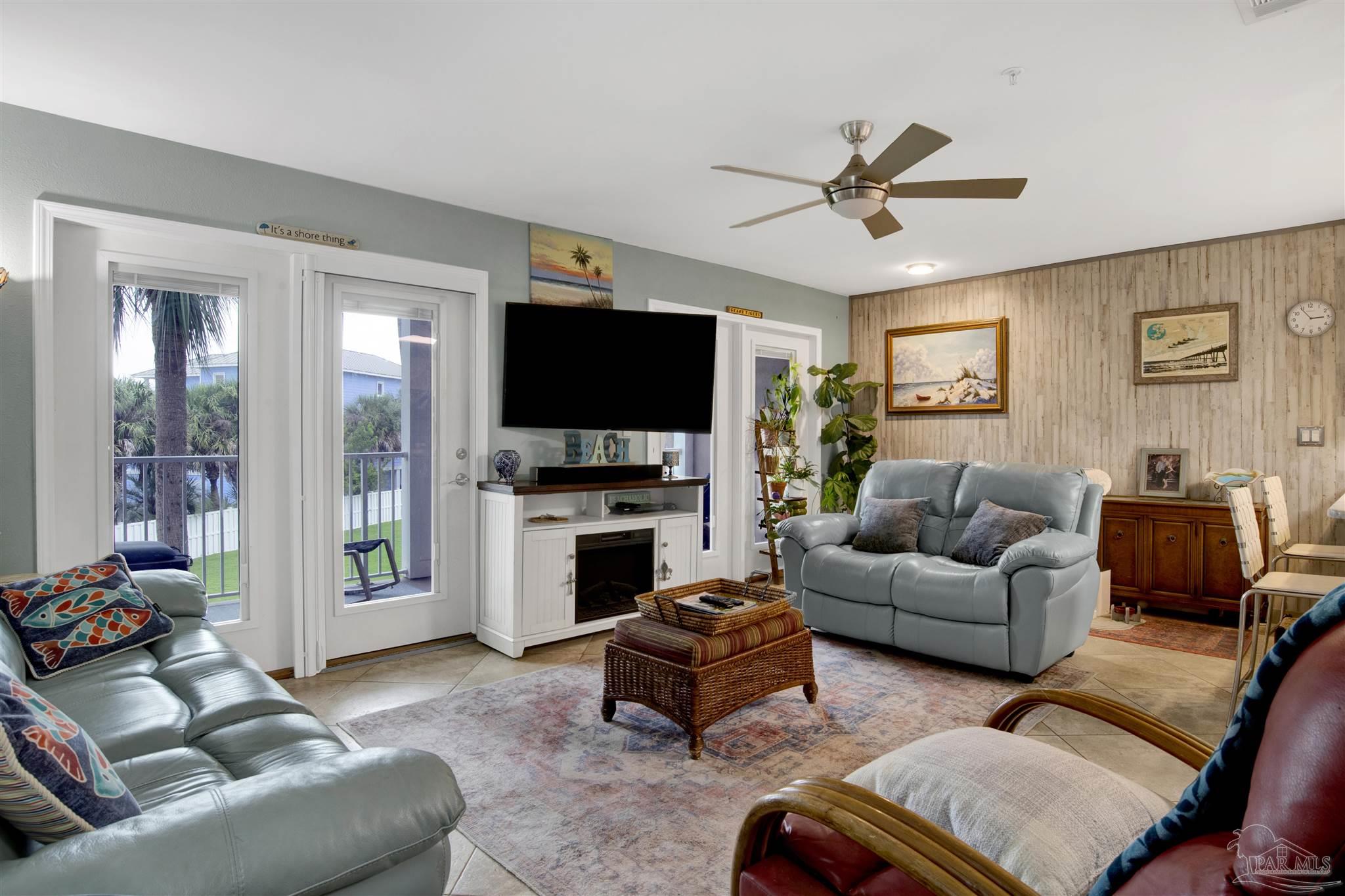 13351 Johnson Beach Road, Unit 203E Perdido Key, FL 32507 - Photo 5 of 55 a living room with furniture and a flat screen tv