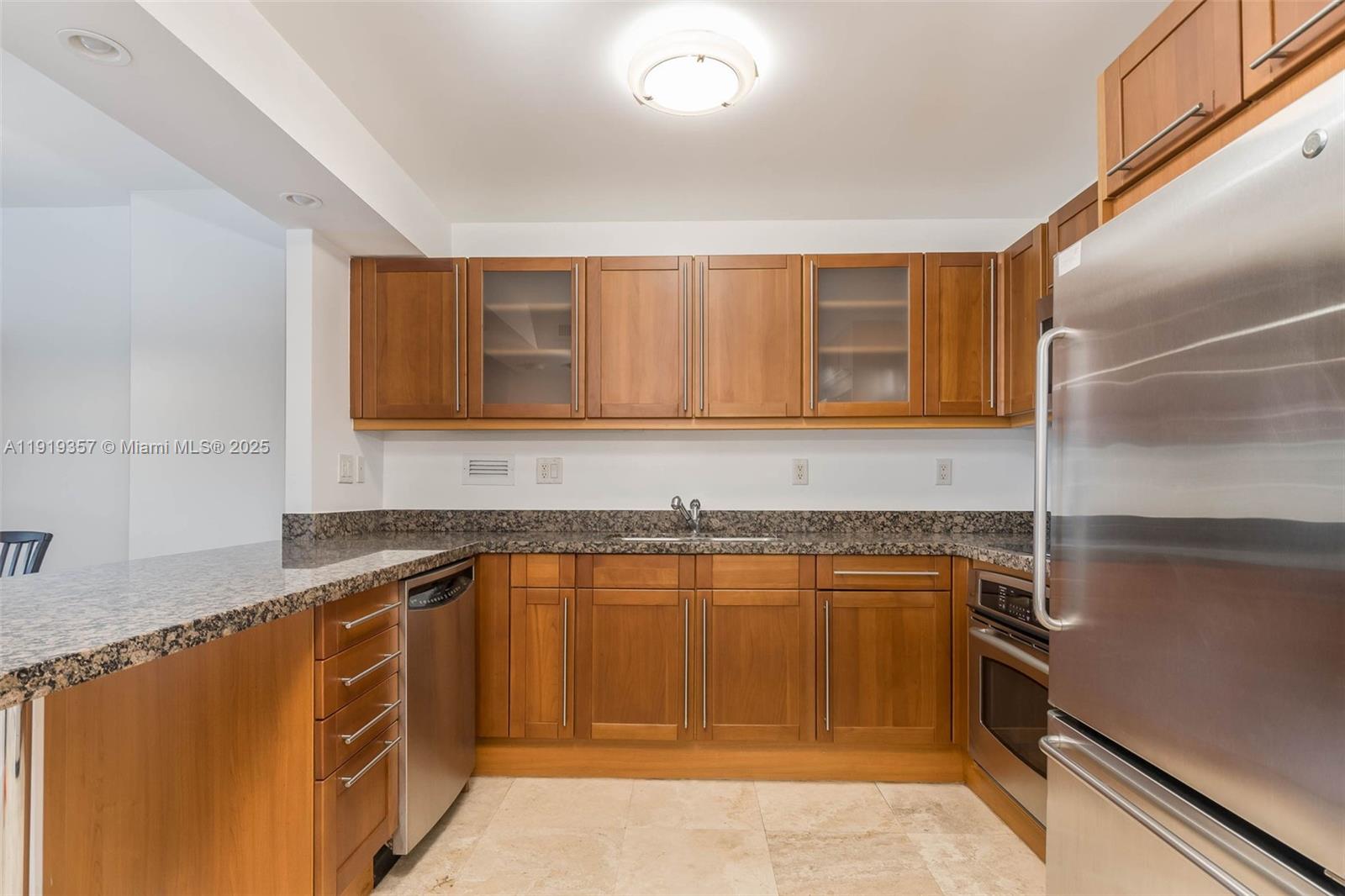 2301 Collins Avenue, Unit 1512 Miami Beach, FL 33139 - Photo 11 of 34 a kitchen with a sink and cabinets