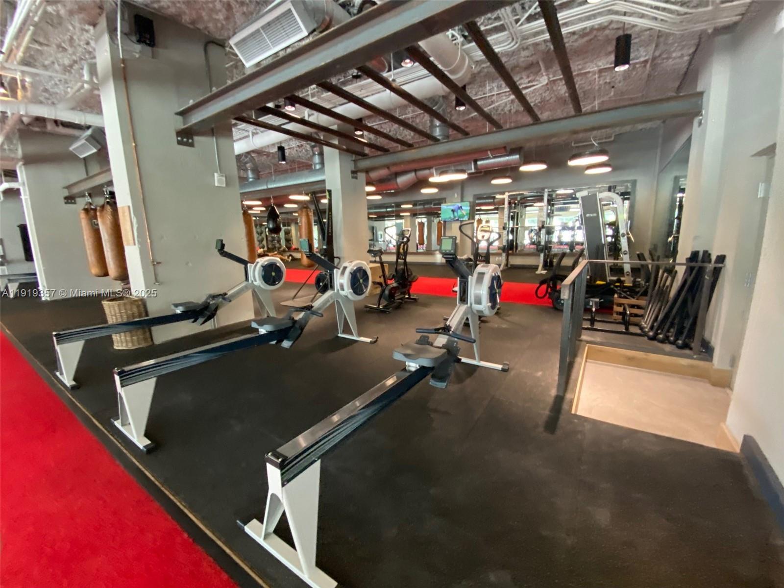 2301 Collins Avenue, Unit 1512 Miami Beach, FL 33139 - Photo 27 of 34 a view of a room with gym equipment