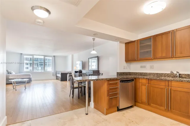 a kitchen with lots of counter top space and appliances