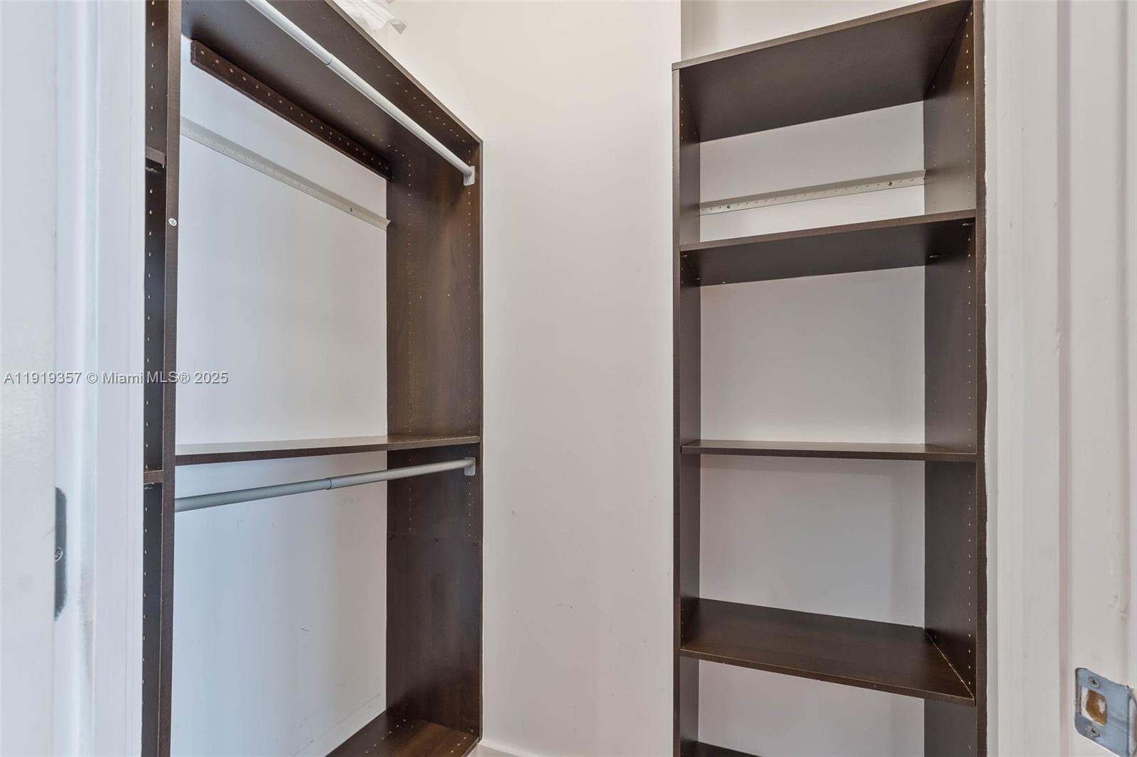 2301 Collins Avenue, Unit 1512 Miami Beach, FL 33139 - Photo 10 of 34 a view of walk in closet with empty racks