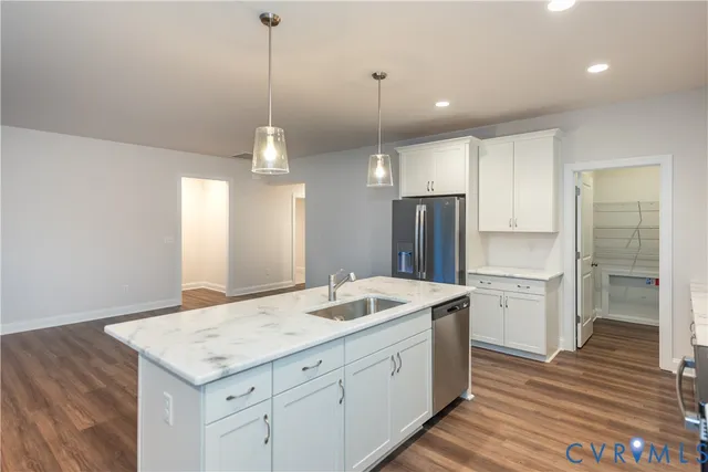 a bathroom with a sink a vanity a mirror and a shower
