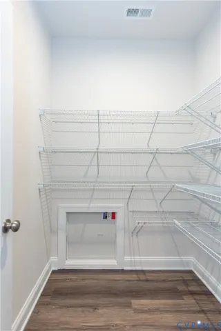a bathroom with a double vanity sink toilet and mirror