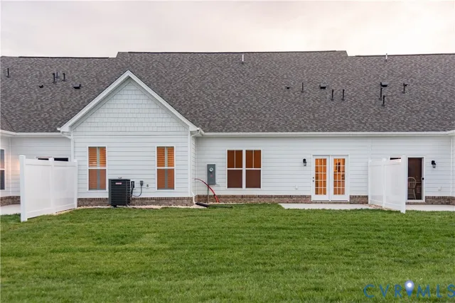 a front view of house with yard and outdoor seating