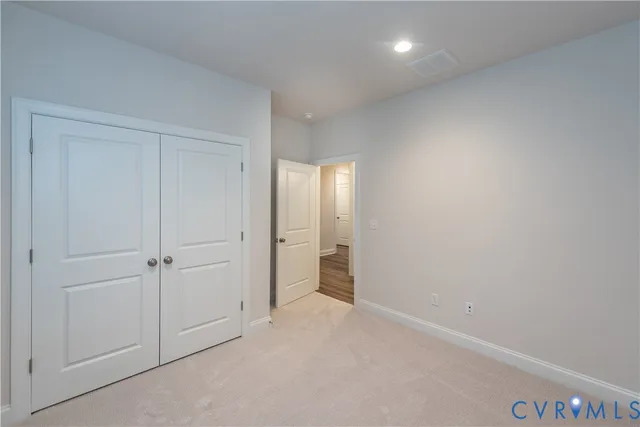 an empty room with closet area