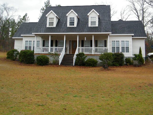 1179 Hamlin Road Lizella, GA 31052 - Photo 1 of 1 a front view of house with yard and green space