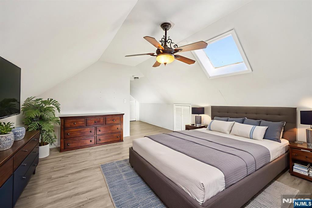 190 Bell Street Belleville, NJ 07109 - Photo 13 of 21 a bedroom with bed and a chandelier