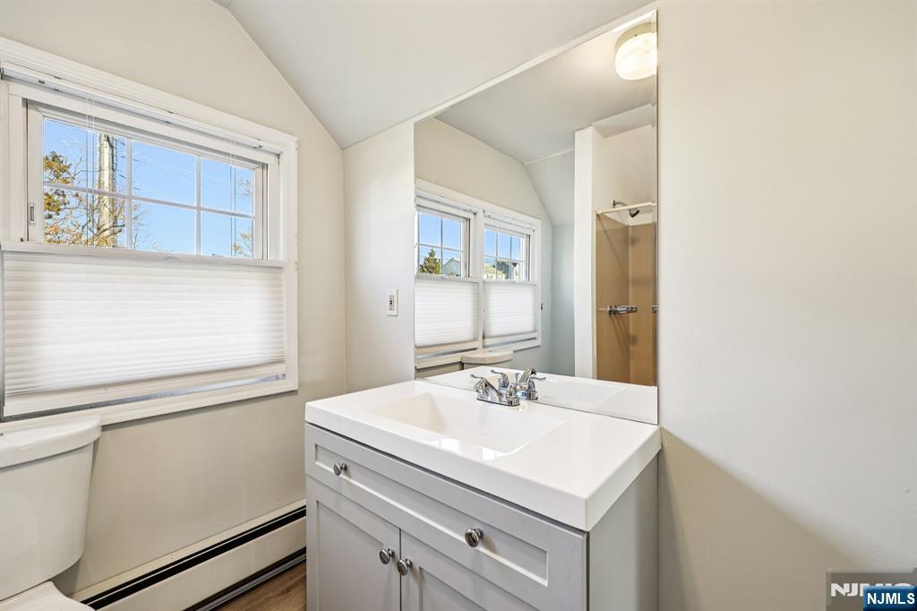 190 Bell Street Belleville, NJ 07109 - Photo 14 of 21 a bathroom with a sink and a mirror