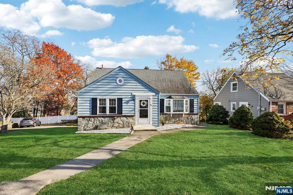 190 Bell Street Belleville, NJ 07109 - Photo 2 of 21 a front view of house with a garden and trees