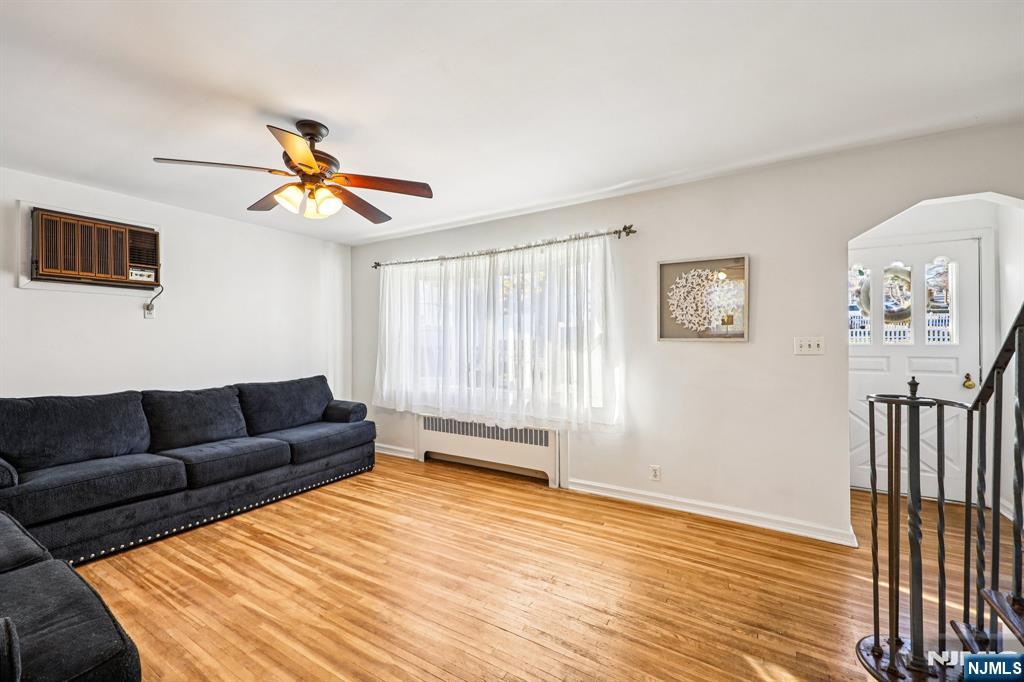 190 Bell Street Belleville, NJ 07109 - Photo 7 of 21 a living room with furniture and a wooden floor
