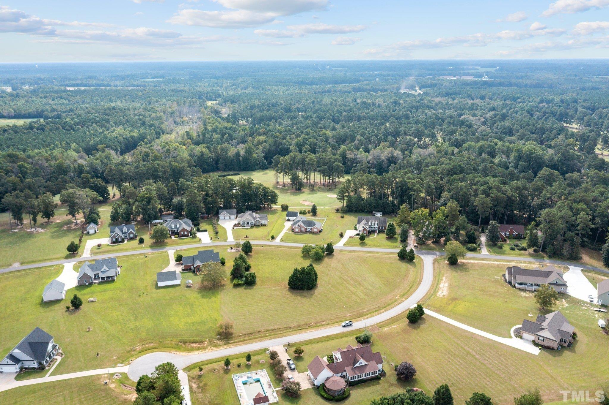 84 Golf Course Drive Pinetops, NC 27864 - Photo 12 of 38 a view of a swimming pool with a patio