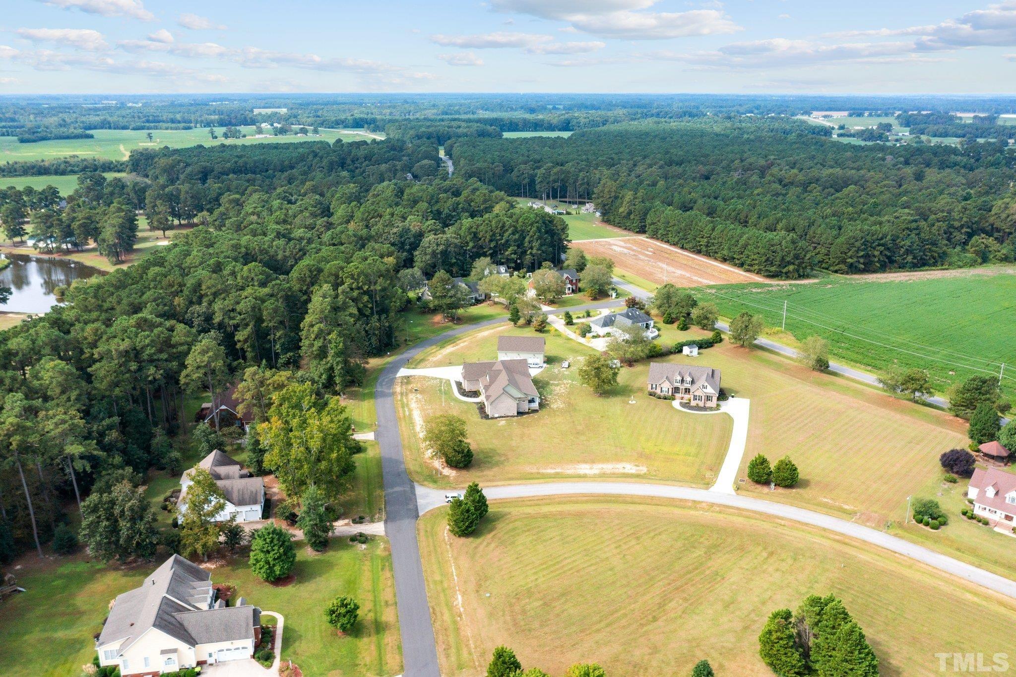 84 Golf Course Drive Pinetops, NC 27864 - Photo 16 of 38 a view of a swimming pool with a yard