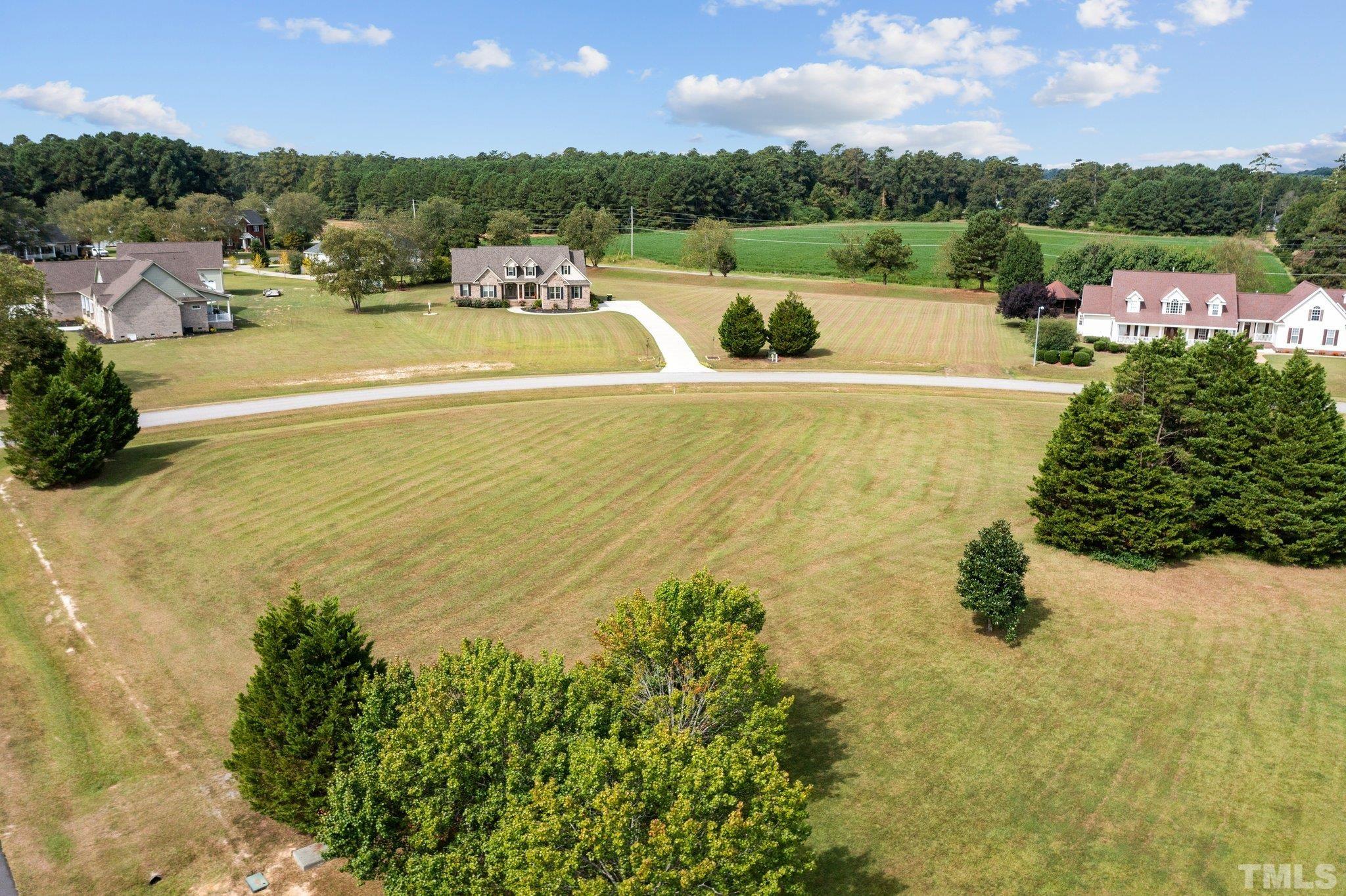 84 Golf Course Drive Pinetops, NC 27864 - Photo 17 of 38 a view of a swimming pool and lake view